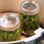two jars of green beans in a pressure canner